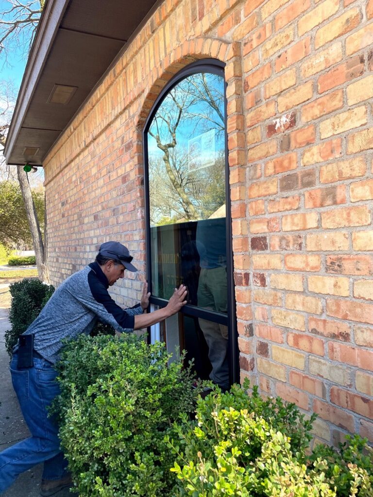 A-man-installing-energy-efficient-picture-replacement-windows-in-knoxville-tn